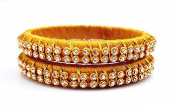 Add A Little More Glam To Look With This Beautiful Bangle Set Made With Resham Thread And Beautified with Stone Work. It Can Be Paired With Same Or Any Contrasting Colored Thraditional Attire. Buy Now.