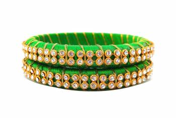 Add A Little More Glam To Look With This Beautiful Bangle Set Made With Resham Thread And Beautified with Stone Work. It Can Be Paired With Same Or Any Contrasting Colored Thraditional Attire. Buy Now.