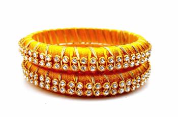 Add A Little More Glam To Look With This Beautiful Bangle Set Made With Resham Thread And Beautified with Stone Work. It Can Be Paired With Same Or Any Contrasting Colored Thraditional Attire. Buy Now.