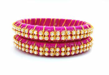 Add A Little More Glam To Look With This Beautiful Bangle Set Made With Resham Thread And Beautified with Stone Work. It Can Be Paired With Same Or Any Contrasting Colored Thraditional Attire. Buy Now.