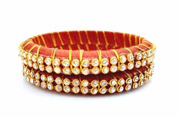 Add A Little More Glam To Look With This Beautiful Bangle Set Made With Resham Thread And Beautified with Stone Work. It Can Be Paired With Same Or Any Contrasting Colored Thraditional Attire. Buy Now.