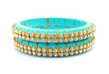 Add A Little More Glam To Look With This Beautiful Bangle Set Made With Resham Thread And Beautified with Stone Work. It Can Be Paired With Same Or Any Contrasting Colored Thraditional Attire. Buy Now.