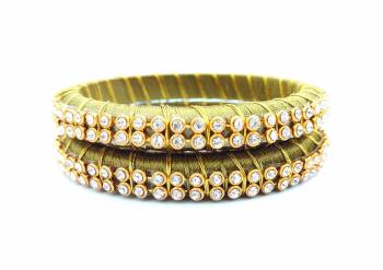 Add A Little More Glam To Look With This Beautiful Bangle Set Made With Resham Thread And Beautified with Stone Work. It Can Be Paired With Same Or Any Contrasting Colored Thraditional Attire. Buy Now.