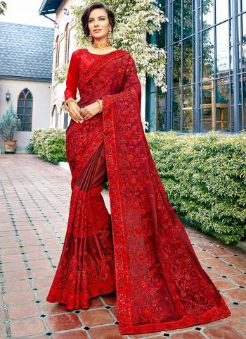 Adorn The Pretty Angelic Look Wearing This Heavy Designer Saree In Red Color Paired With Red Colored Blouse. This Saree Is Silk Based With Heavy Embroidery Paired With Art Silk fabricated Blouse. 