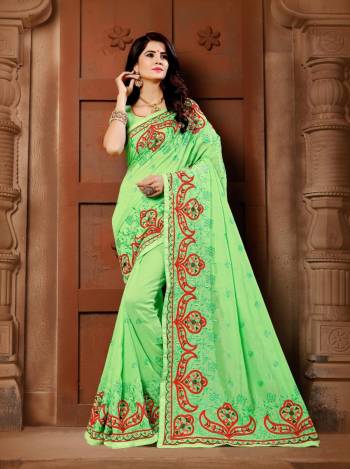 Celebrate This Festive Season With Beauty And Comfort Wearing This Pretty Light Green Colored Saree. This Saree And Blouse Are Silk Beautified With Contrasting Resham Work.