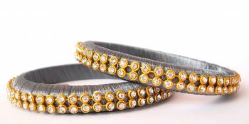 Add A Little More Glam To Look With This Beautiful Bangle Set Made With Resham Thread And Beautified with Stone Work. It Can Be Paired With Same Or Any Contrasting Colored Thraditional Attire. Buy Now