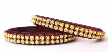 Add A Little More Glam To Look With This Beautiful Bangle Set Made With Resham Thread And Beautified with Stone Work. It Can Be Paired With Same Or Any Contrasting Colored Thraditional Attire. Buy Now