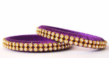 Add A Little More Glam To Look With This Beautiful Bangle Set Made With Resham Thread And Beautified with Stone Work. It Can Be Paired With Same Or Any Contrasting Colored Thraditional Attire. Buy Now