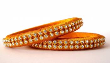 Add A Little More Glam To Look With This Beautiful Bangle Set Made With Resham Thread And Beautified with Stone Work. It Can Be Paired With Same Or Any Contrasting Colored Thraditional Attire. Buy Now