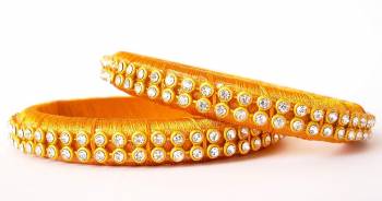 Add A Little More Glam To Look With This Beautiful Bangle Set Made With Resham Thread And Beautified with Stone Work. It Can Be Paired With Same Or Any Contrasting Colored Thraditional Attire. Buy Now