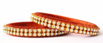 Add A Little More Glam To Look With This Beautiful Bangle Set Made With Resham Thread And Beautified with Stone Work. It Can Be Paired With Same Or Any Contrasting Colored Thraditional Attire. Buy Now