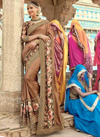 Simple And Elegant Looking Designer Saree In Here In Beige Color Paired With Brown Colored Blouse. This Saree And Blouse Are Silk based Beautified With Prints And Embroidery. Buy Now.