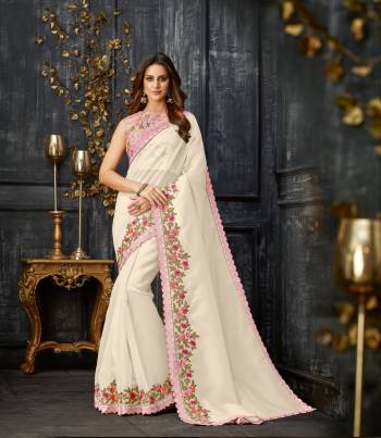 Define perfection and purity like no other in this beautiful white and pink , subtly  floral embroidered saree. 