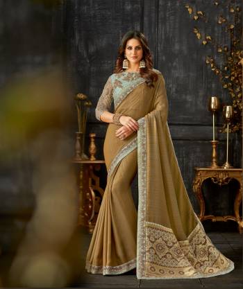 Bind in threads of love in this gorgeous dual tone silk saree that'll make you fall in love instantly.  Drape the saree in free fall pallu style to look classic. 