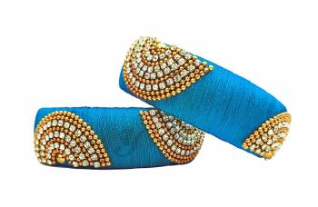 Grab This Lovely Pair Of Kada Bangles Which Can Be Paired With Any Bangles Or Can Simply Be Wore. These Bangles Are Made With Resham Thread And Stone Work, So It Is Light Weight And Easy To Carry All Day Long.