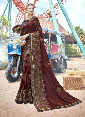 Enhance Your Personality Wearing This Designer Saree In Brown Color Paired With Brown Colored Blouse. This Saree Is Fabricated On Silk Georgette Paired With Art Silk Fabricated Blouse. 