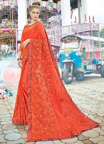 Adorn The Pretty Angelic Look Wearing This Designer Saree In Orange Color Paired With Orange Colored Blouse. This Saree Is Fabricated On Chiffon Paired With Art Silk Blouse. It Is Beautiful Tone To Tone Embroidery Over The Saree.