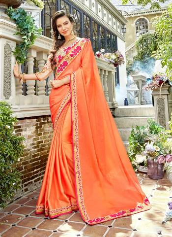 Orange Color Induces Perfect Summery Appeal To Any Outfit, So Grab This Designer Saree In Orange Color Paired With Light peach Colored Blouse. This Saree Is Fabricated On Satin Georgette Paired With Art Silk Fabricated Blouse. 