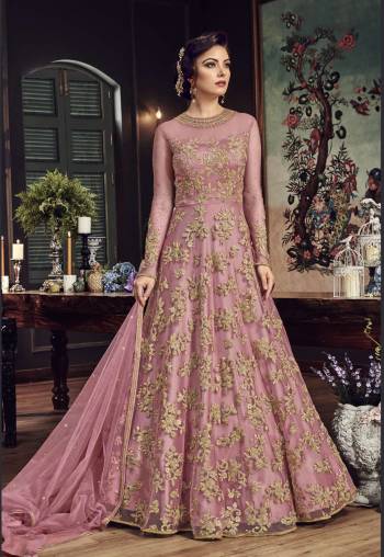 Look The Most Prettiest Of All Wearing This Heavy Designer Floor Length Suit In Pink Color Paired With Pink Colored Bottom And Dupatta. Its Top And Dupatta Are Net Fabricated Paired With Santoon Bottom. Buy Now.