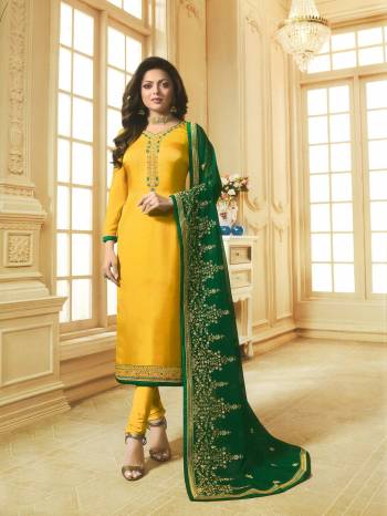 Celebrate This Festive Season With Ease And Comfort Wearing This Designer Straight Suit In Yellow Color. Its Top Is Georgette Satin Fabricated Paired With Santoon Bottom And Net Fabricated Embroidered Dupatta. 