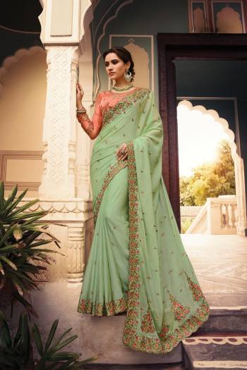 Look The Most Prettiest Of all Wearing This Designer Saree In Pastel Green Color Paired With Contrasting Peach Colored Blouse. This Saree Is Fabricated On Soft Silk Paired With Art Silk Fabricated Blouse. Its Saree And Blouse Are Beautified With Heavy Embroidery Work. 