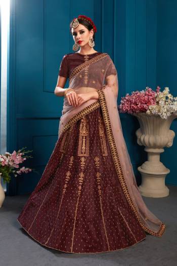 For A Bold And Beautiful Look, Grab This Designer Lehenga Choli In Brown Color Paired With Contrasting Baby Pink Colored Dupatta. This Lehenga Choli Is Satin Based Paired With Net Fabricated Dupatta. Buy This Lehenga Choli Now.