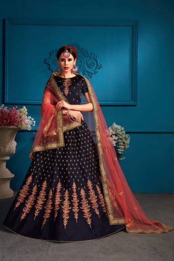 Enhance Your Personality Wearing This Designer Lehenga Choli In Navy Blue Color Paired With Contrasting Dark Peach Colored Dupatta.  Its Blouse And Lehenga Are Fabricated On Satin Paired With Net Fabricated Dupatta. All Its Fabrics Ensures Superb Comfort All Day Long. Buy Now.