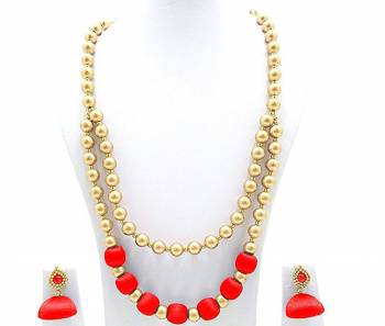 You Will Earn Lots Of Compliments With This Attractive Looking Necklace Set Made With Pearls And Resham Thread Balls. This Can Be Paired With Same Or Contrasting Colored Ethnic Attire. Also It Has A Pretty Pair Of Earrings Along.