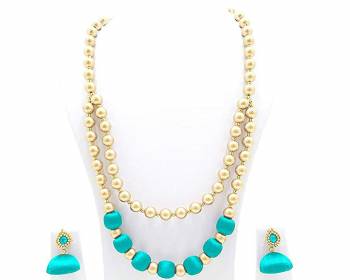 Grab This Beautiful Double Layered Necklace Set Made With Pearls And Resham Thread Balls. This Necklace Set Comes With A Pretty Pair Of Earrings, Pair This Up Any Same Or Contrasting Colored Ethnic Attire. Buy Now.