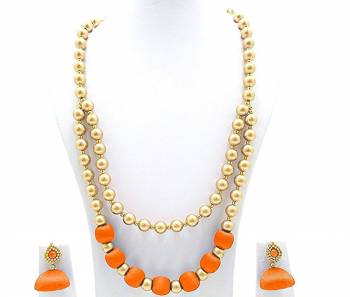 Grab This Beautiful Double Layered Necklace Set Made With Pearls And Resham Thread Balls. This Necklace Set Comes With A Pretty Pair Of Earrings, Pair This Up Any Same Or Contrasting Colored Ethnic Attire. Buy Now.