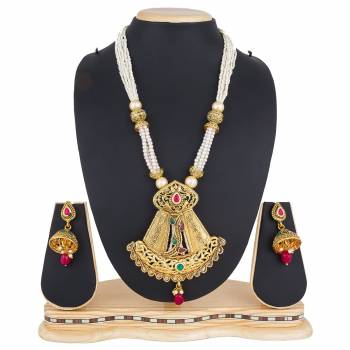 Add This Pretty Heavy Necklace Set In Golden Color. This Lovely Set Comes A Pair Of Earrings . It Can Be Paired With Any Colored Traditional Attire. Buy Now.