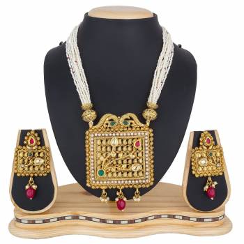 Add This Pretty Heavy Necklace Set In Golden Color. This Lovely Set Comes A Pair Of Earrings . It Can Be Paired With Any Colored Traditional Attire. Buy Now.