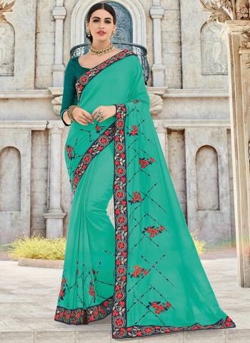 Wear this Sea green color silk fabrics saree. Ideal for party, festive & social gatherings. this gorgeous saree featuring a beautiful mix of designs. Its attractive color and designer heavy embroidered design, Flower patch design, stone design, beautiful floral design work over the attire & contrast hemline adds to the look. Comes along with a contrast unstitched blouse.