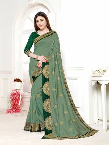 Grab This Beautiful Designer Saree In Green Color Paired With Dark Green Colored Blouse. This Saree And Blouse Are Silk Based Beautified With Attractive Embroidery. Buy This Now.