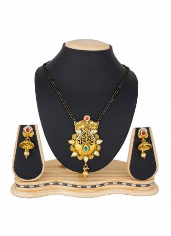 Grab This Heavy Mangalsutra Set In Golden Color Which Comes With A Pair Of Earrings, Also It Can Be Paired With Colored Ethnic Attire. Buy Now.