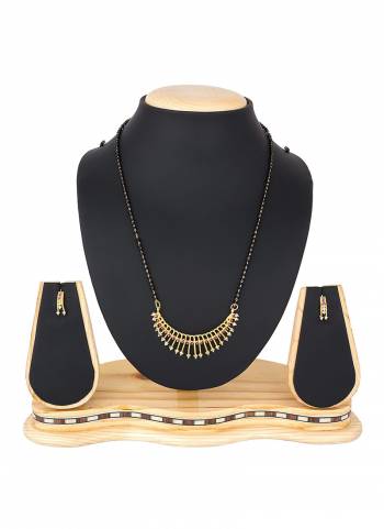 To Give An Elegant Look To Your Neckline, Grab This Pretty Elegant Looking Mangalsutra Set In Golden Color Beautified With Diamond Work All Over. It Can Be Paired With Any Colored Attire. Buy Now.