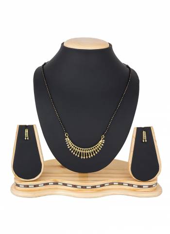 To Give An Elegant Look To Your Neckline, Grab This Pretty Elegant Looking Mangalsutra Set In Golden Color Beautified With Diamond Work All Over. It Can Be Paired With Any Colored Attire. Buy Now.