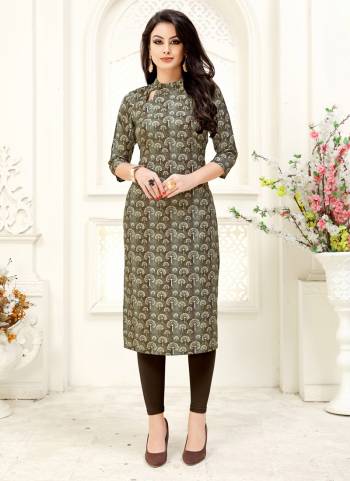 Add This Lovely Kurti To Your Wardrobe In Brown And Grey Color Fabricated on Crepe. It Has Pretty Small Prints All Over It. Buy Now.