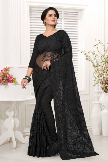 For A Bold And Beautiful Look, Grab This Designer Saree In Black Color. This Saree And Blouse Are Net Based Beautified With Tone To Tone Thread Work And Stone Work. It Also Comes With A Same Colored Satin Inner. 