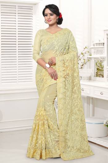 Simple And Elegant Looking Designer Saree In Here In Cream Color Whichi Gives An Elegant Look To Your Personality. This Saree And Blouse Are Net Based Beautified With Tone To Tone Work. 