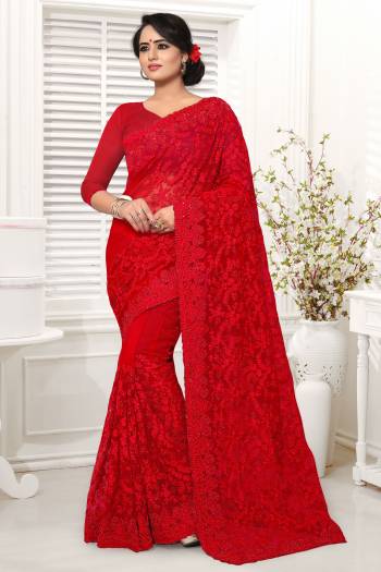 Adorn The Pretty Angelic Look In This Lovely Red Colored Saree Paired With Red colored Blouse. This Saree And Blouse Are Net Based Beautified With Thread And Stone Work. It Is Light Weight And Easy To Carry All Day Long. 