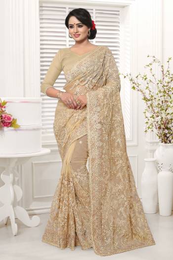 Simple And Elegant Looking Designer Saree In Here In Beige Color Whichi Gives An Elegant Look To Your Personality. This Saree And Blouse Are Net Based Beautified With Tone To Tone Work. 