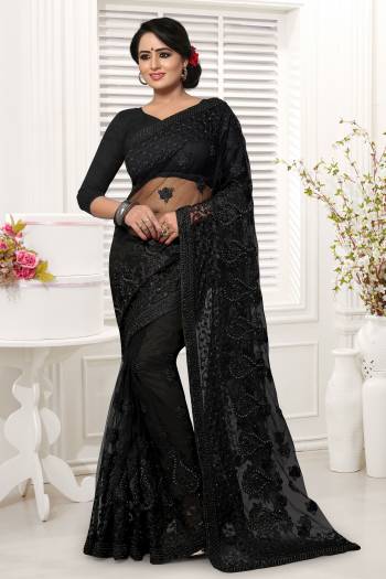 For A Bold And Beautiful Look, Grab This Designer Saree In Black Color. This Saree And Blouse Are Net Based Beautified With Tone To Tone Thread Work And Stone Work. It Also Comes With A Same Colored Satin Inner. 