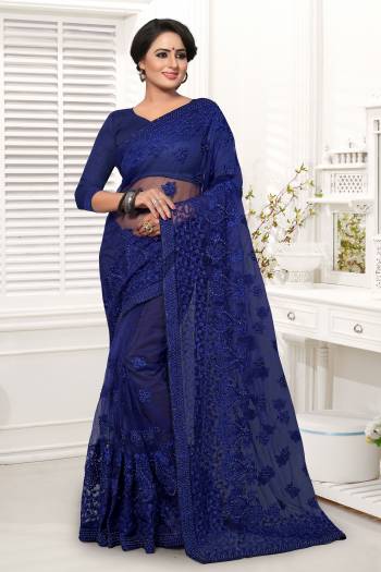 Shine Bright In This Beautiful Designer Royal Blue Colored Saree Paired With Royal Blue Colored Blouse. It Is Net Based Beautified With Tone To Tone Embroidery. Buy Now.