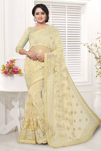 Simple And Elegant Looking Designer Saree In Here In Cream Color Whichi Gives An Elegant Look To Your Personality. This Saree And Blouse Are Net Based Beautified With Tone To Tone Work. 