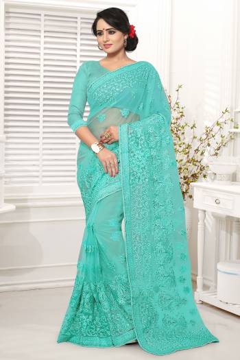 New Shade Is Here To Add Into Your Wardrobe With This Designer Saree In Turquoise Blue Color Paired With Turquoise Blue Colored Blouse. This Saree And Blouse Are Net Based Which Comes With A Satin Inner. Buy This Now.