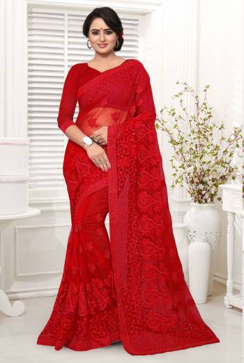 Adorn The Pretty Angelic Look In This Lovely Red Colored Saree Paired With Red colored Blouse. This Saree And Blouse Are Net Based Beautified With Thread And Stone Work. It Is Light Weight And Easy To Carry All Day Long. 