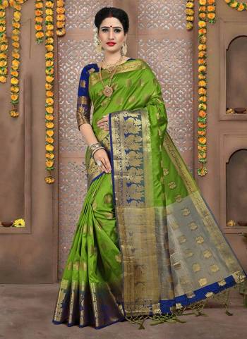 Simple And elegant Looking Silk Based Saree Is Here In Green Color Paired With Dark Blue Colored Blouse. This Saree And Blouse are Fabricated On Art Silk Beautified With Weave All Over It. 