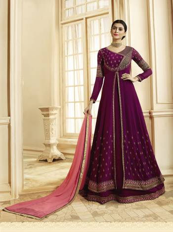 Must Have Shade In Every Womens Wardrobe Is Here With This Designer Floor Length Suit In Wine Color Paired With Contrasting Pink Colored Dupatta. This Suit Is Fabricated On Georgette Paired With Santoon Bottom And Georgette Buy Now.