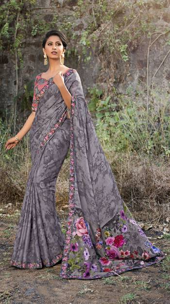 Rich And Elegant Looking Color Pallete Is Here With This Designer Printed Saree In Grey Color Paired With Pink And Grey Colored Blouse. This Saree And Blouse Are Satin Georgette Based Beautified With Floral Prints. 